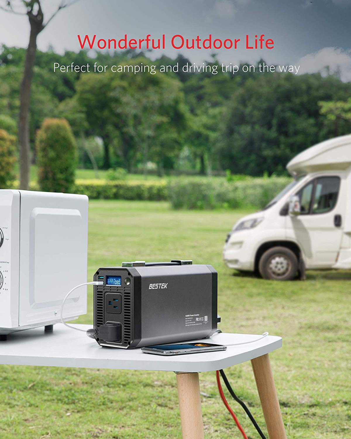 BESTEK 1200W inverter — battery-powered setup at an outdoor campsite