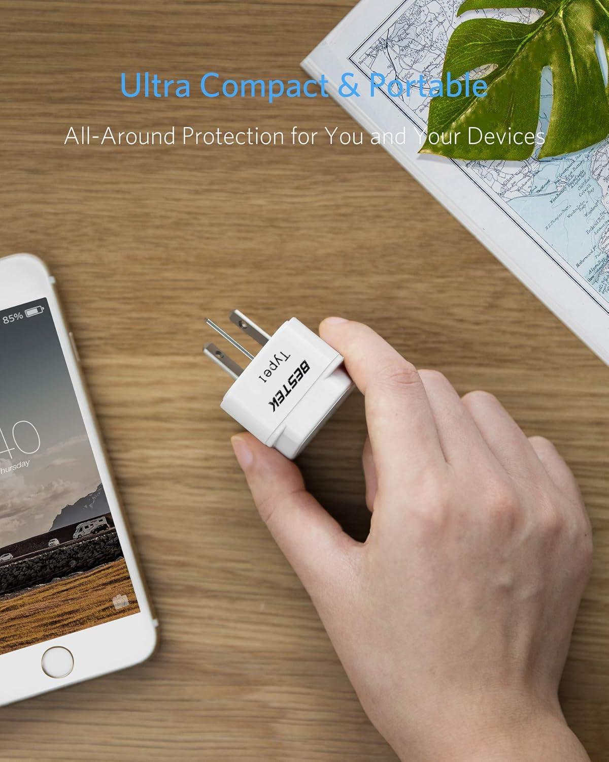 BESTEK travel plug adapter — hand-held plug adapter size comparison