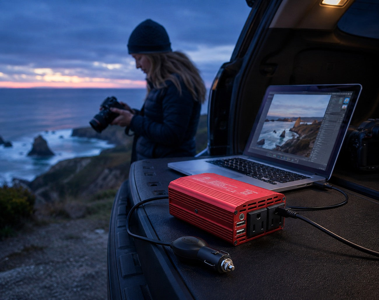 BESTEK power inverter supporting a mobile road-trip workstation at blue hour