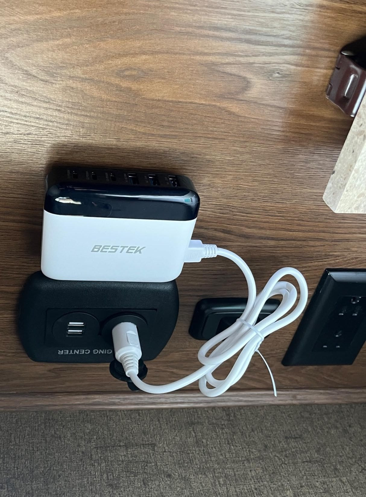 Review photo of a BESTEK multi-port car charger installed in an RV.