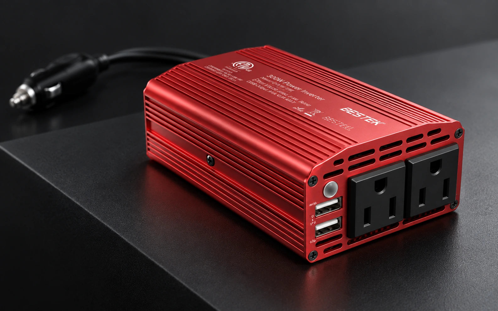 Low-angle material close-up of the BESTEK inverter's red ribbed aluminum housing and recessed side screw
